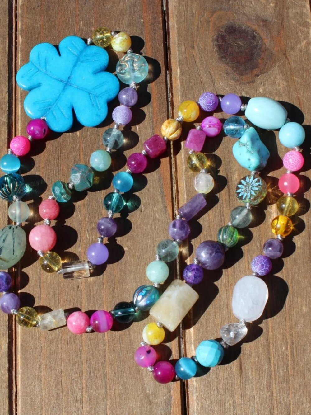 Clover's Promise: A Long Necklace Mosaic of Gemstones